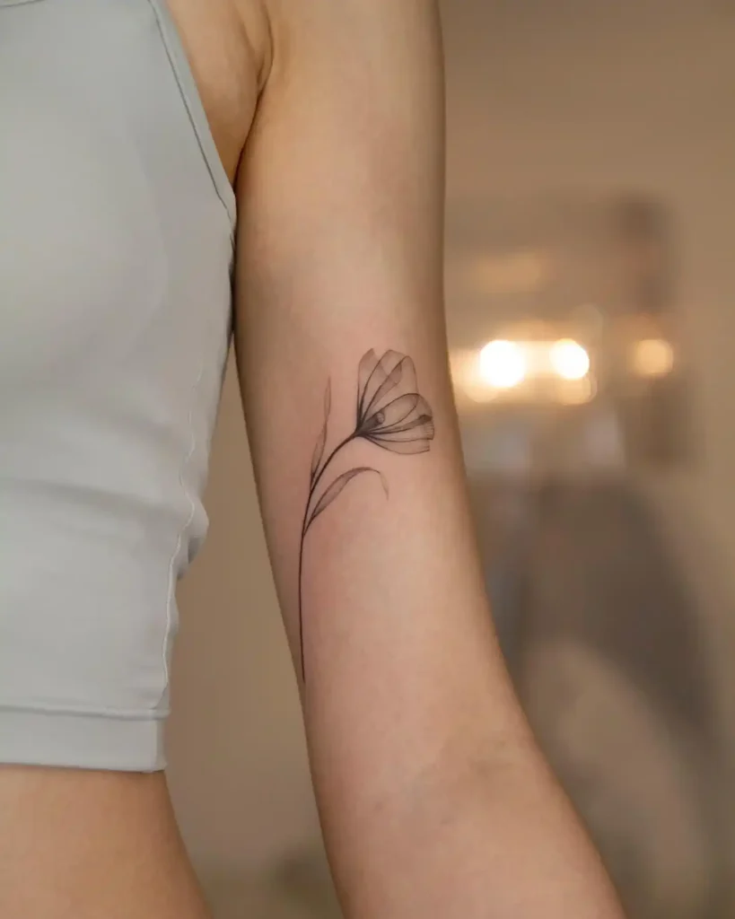 Abstract Blackwork Poppy Tattoo on the Forearm