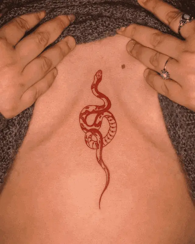 Snake Tattoos On The Sternum