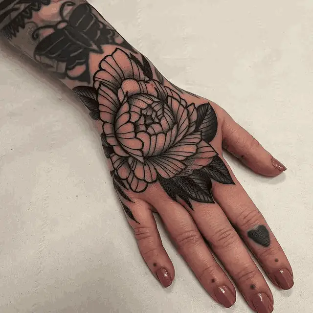 Traditional Flower Hand Tattoo