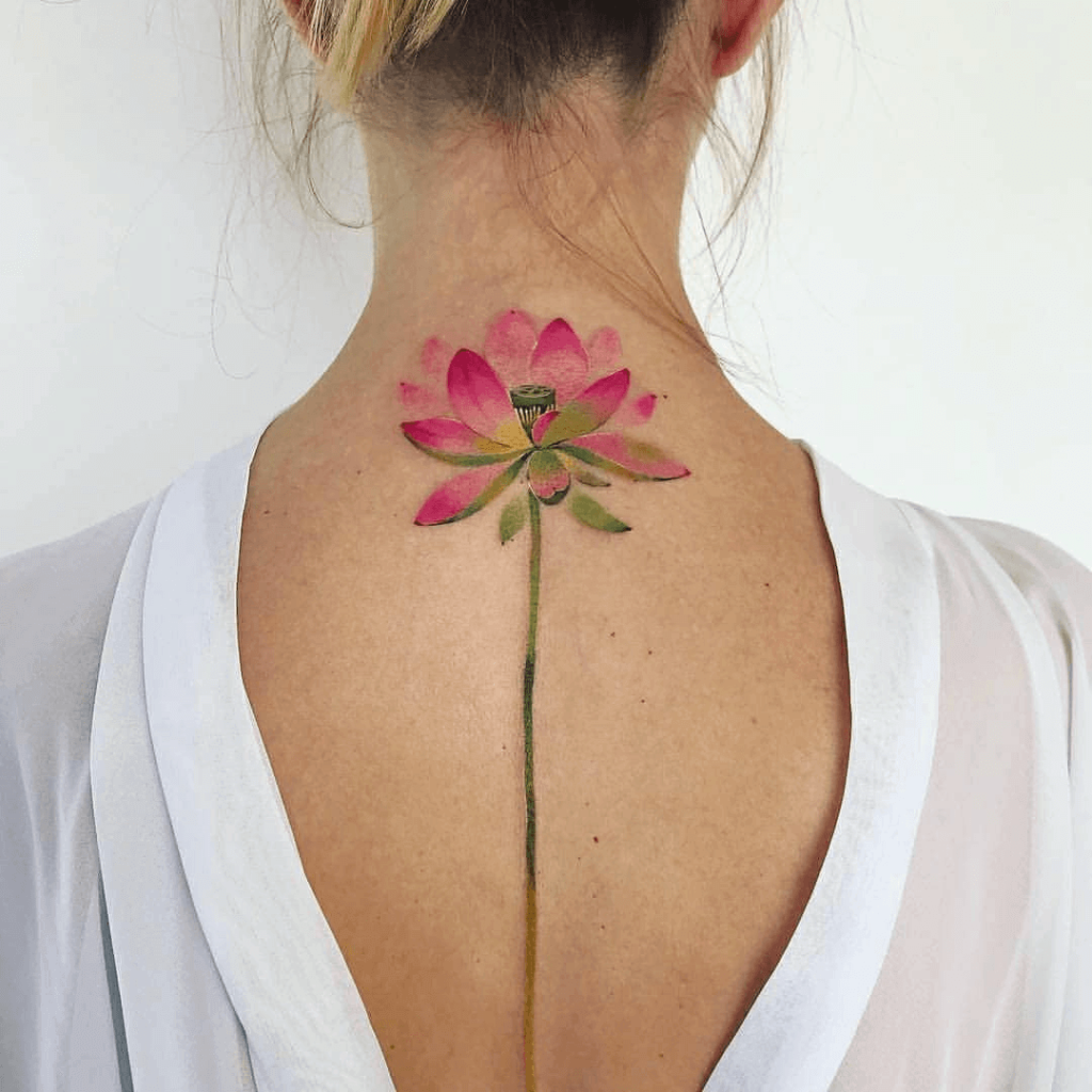 Pink Watercolor Lotus Flower Tattoo on Back of Woman’s Neck