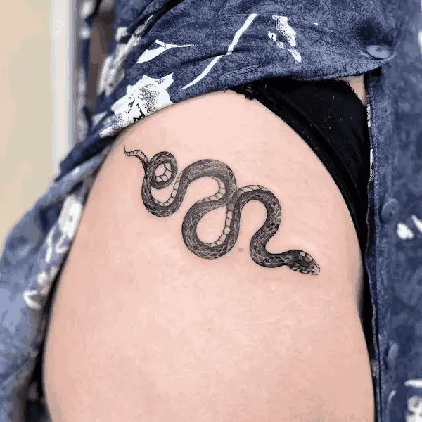 Small Black Snake Hip Tattoo