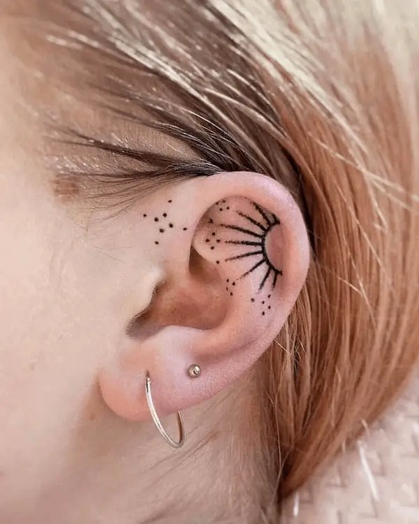 Sun Tattoo on the Inner Ear