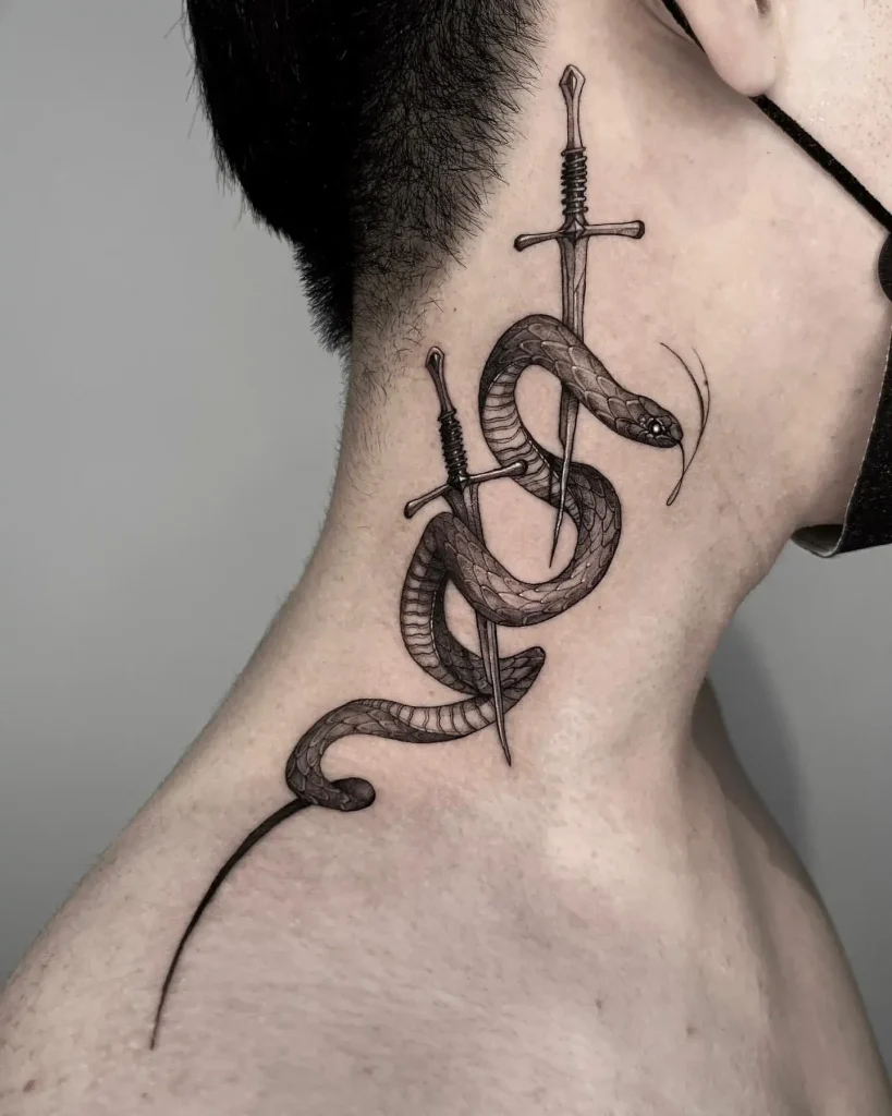 Classic Blackwork Snake and Dagger Tattoo