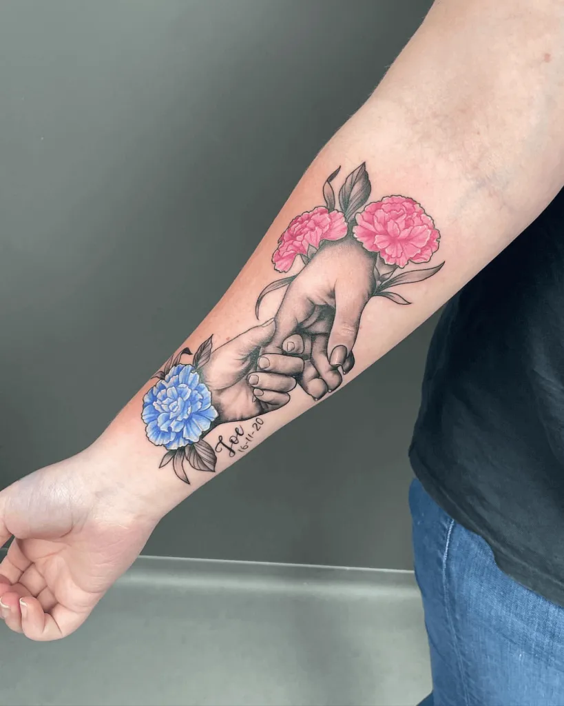 Custom Color/Black and Gray Tattoo of Touching Hands Adorned With Carnations