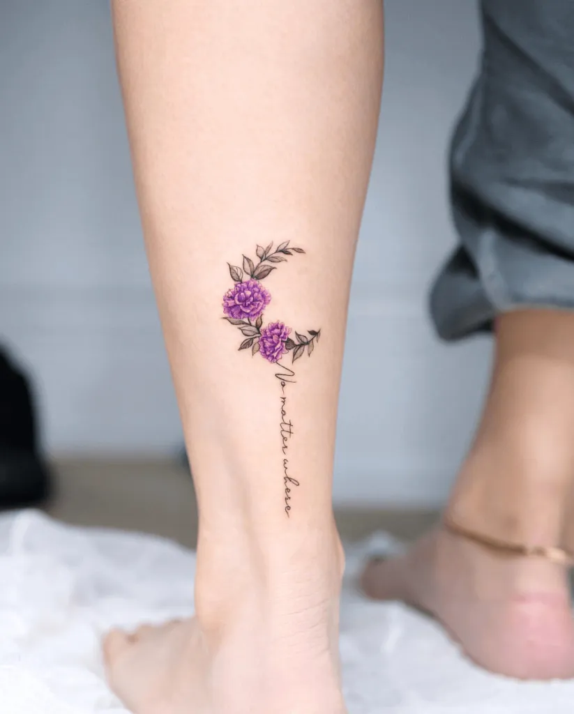 Floral Tattoo of Carnation and Lettering on the Back of the Calf