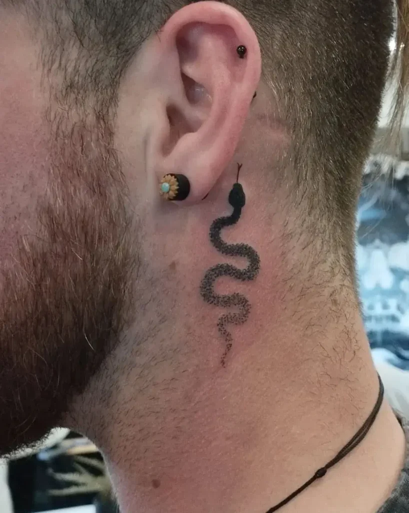 Minimalist Dotwork Snake Tattoo