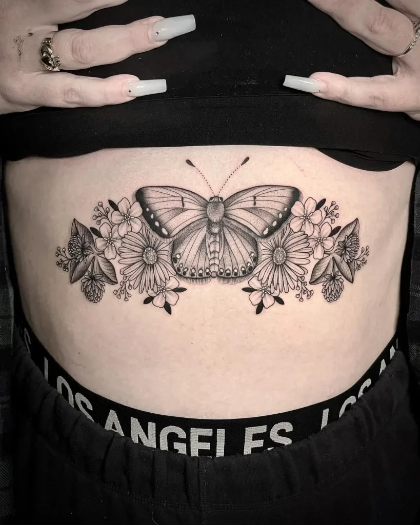 Monochrome Butterfly and Floral Stomach Tattoo