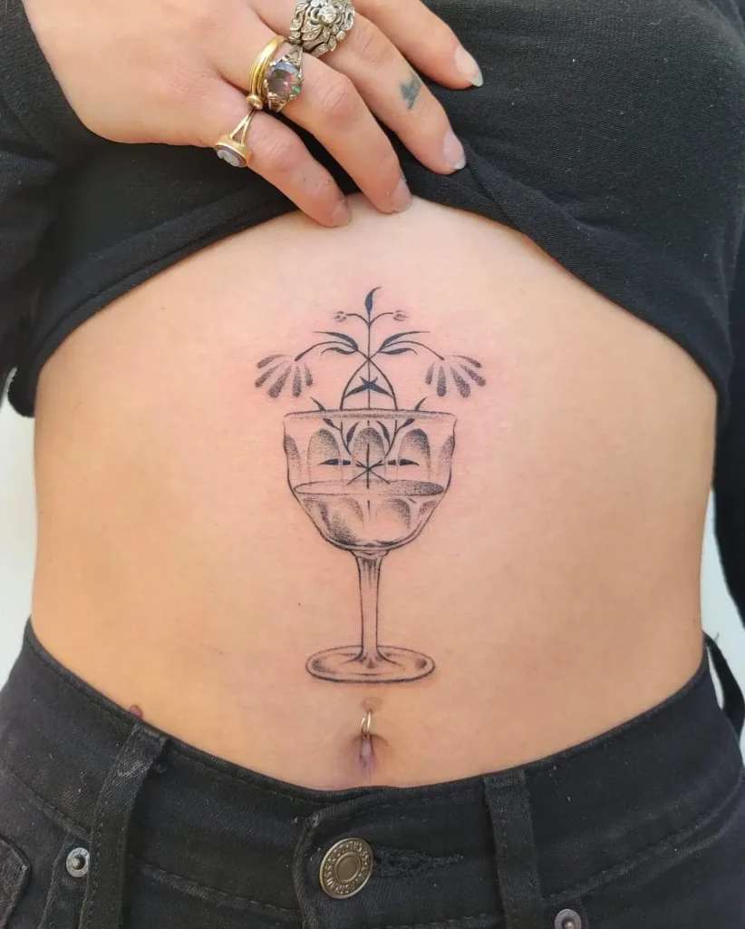 Nature's Elixir in Glass Stomach Tattoo