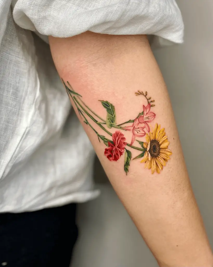 Watercolor Tattoo of Flower Bouquet on Forearm