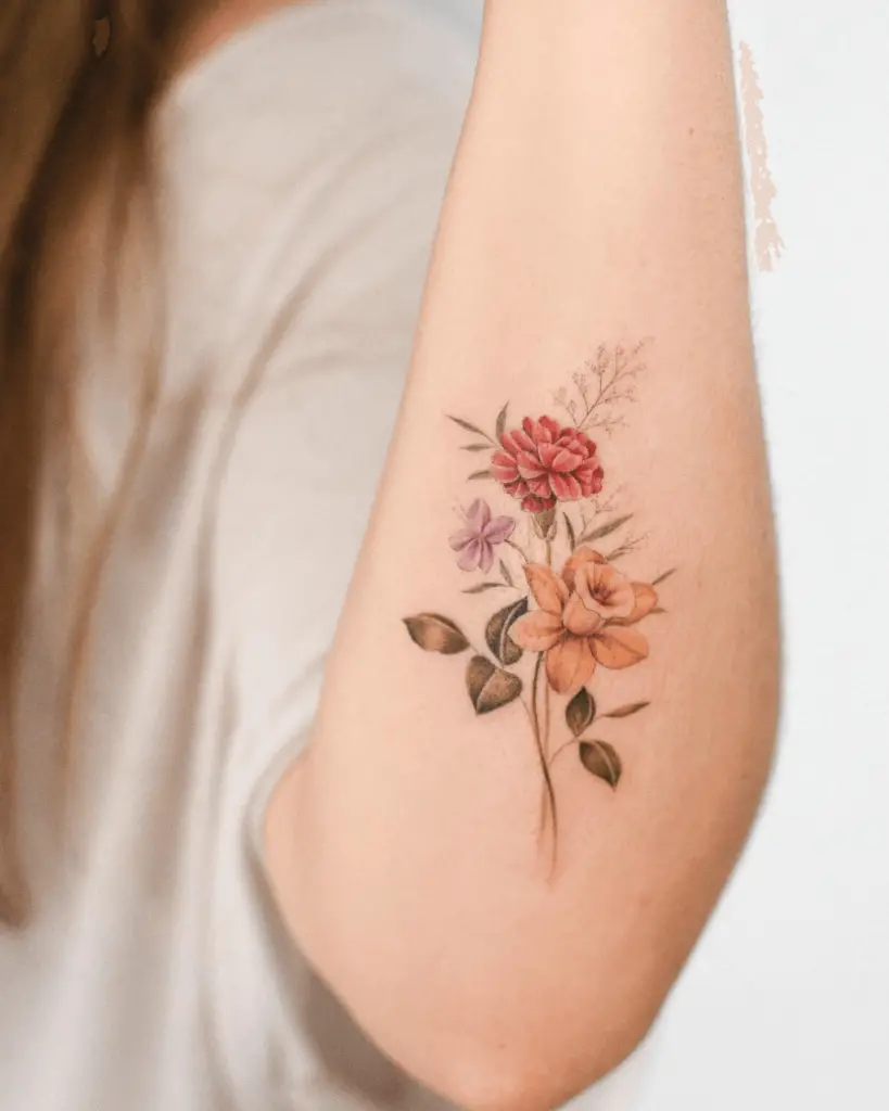 Watercolor Tattoo of Flowers on Forearm