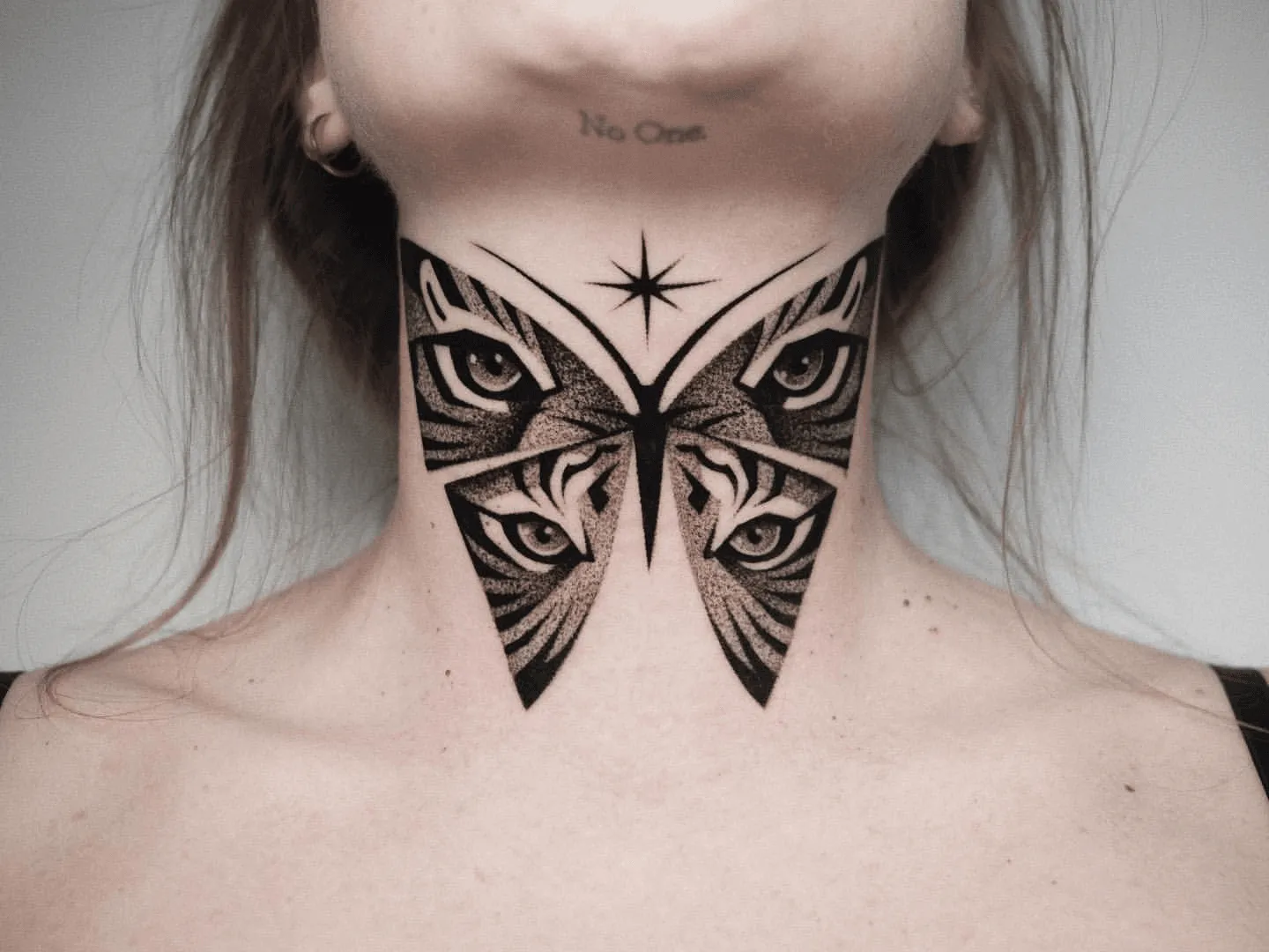 15 Throat Tattoos For Women That Make A Bold Statement