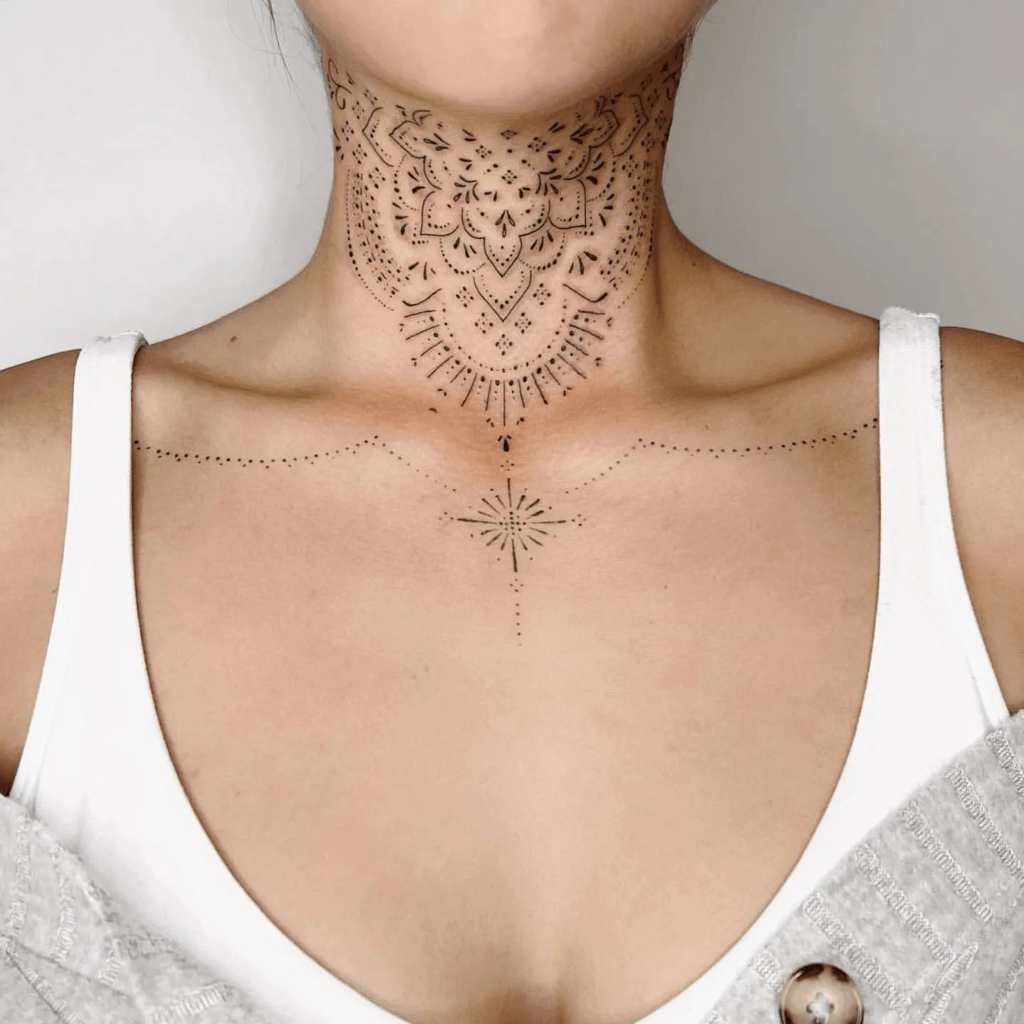 15 Throat Tattoos For Women That Make A Bold Statement