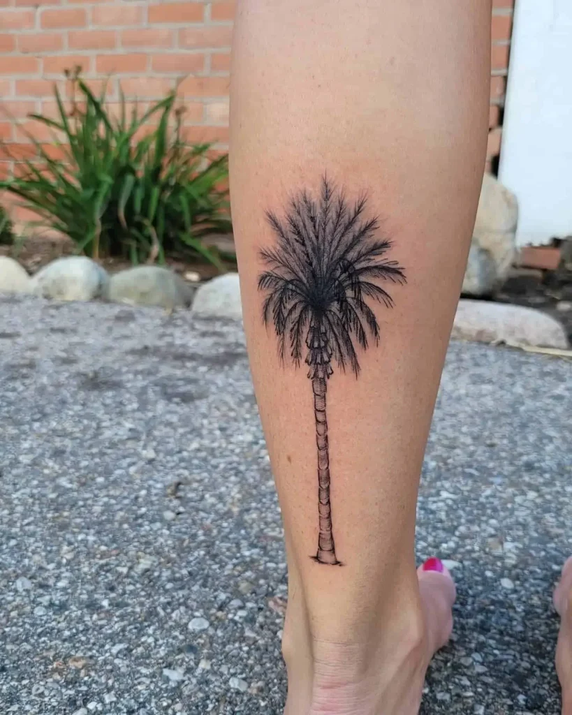 Lone Palm Tree Tattoo on Woman’s Achilles