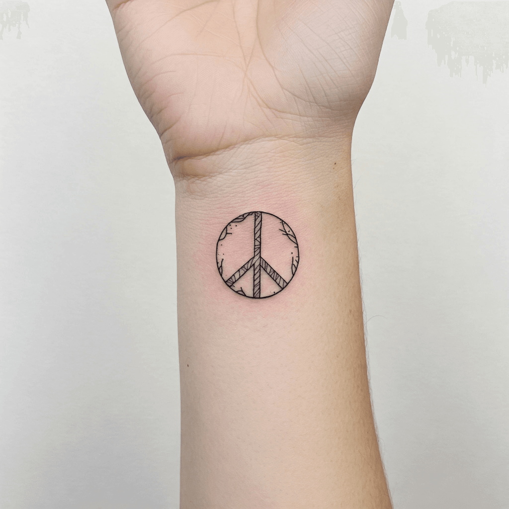 Minimalist Peace Sign Tattoo on the Wrist