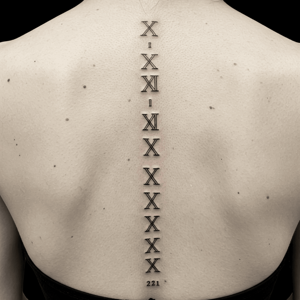 Roman Numeral Spine Tattoo